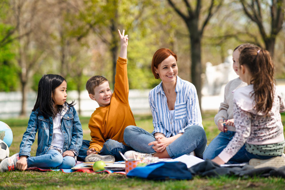 Teacher with students outdoors