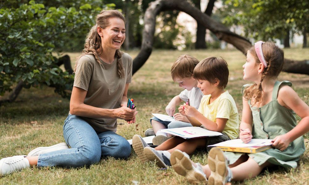 teacher with students outdoors